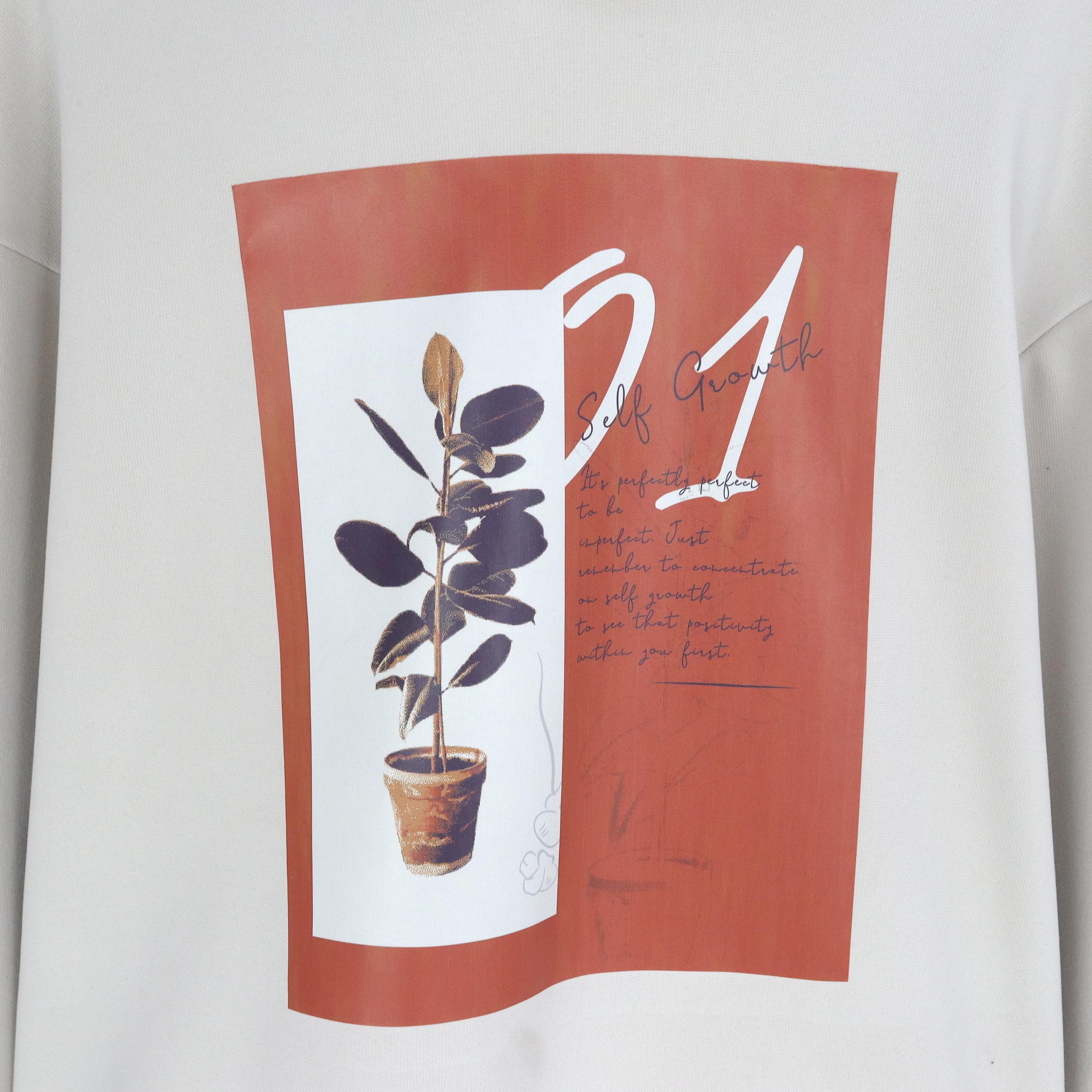 كنزة نسائية فضفاضة برقبة دائرية مزينة برسومات Thumbnail 3